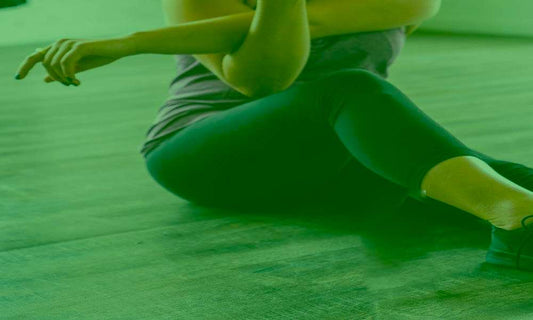 How do some people stay in shape even if their diet isn't that healthy - chikara houses - woman stretching legs on a grey floor