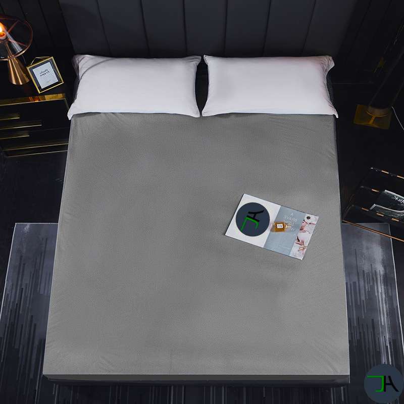 Sleep Soundly All Year Round with Our 100% Waterproof Bamboo Fitted Sheet - Available in Queen, King, and Full Sizes! bed